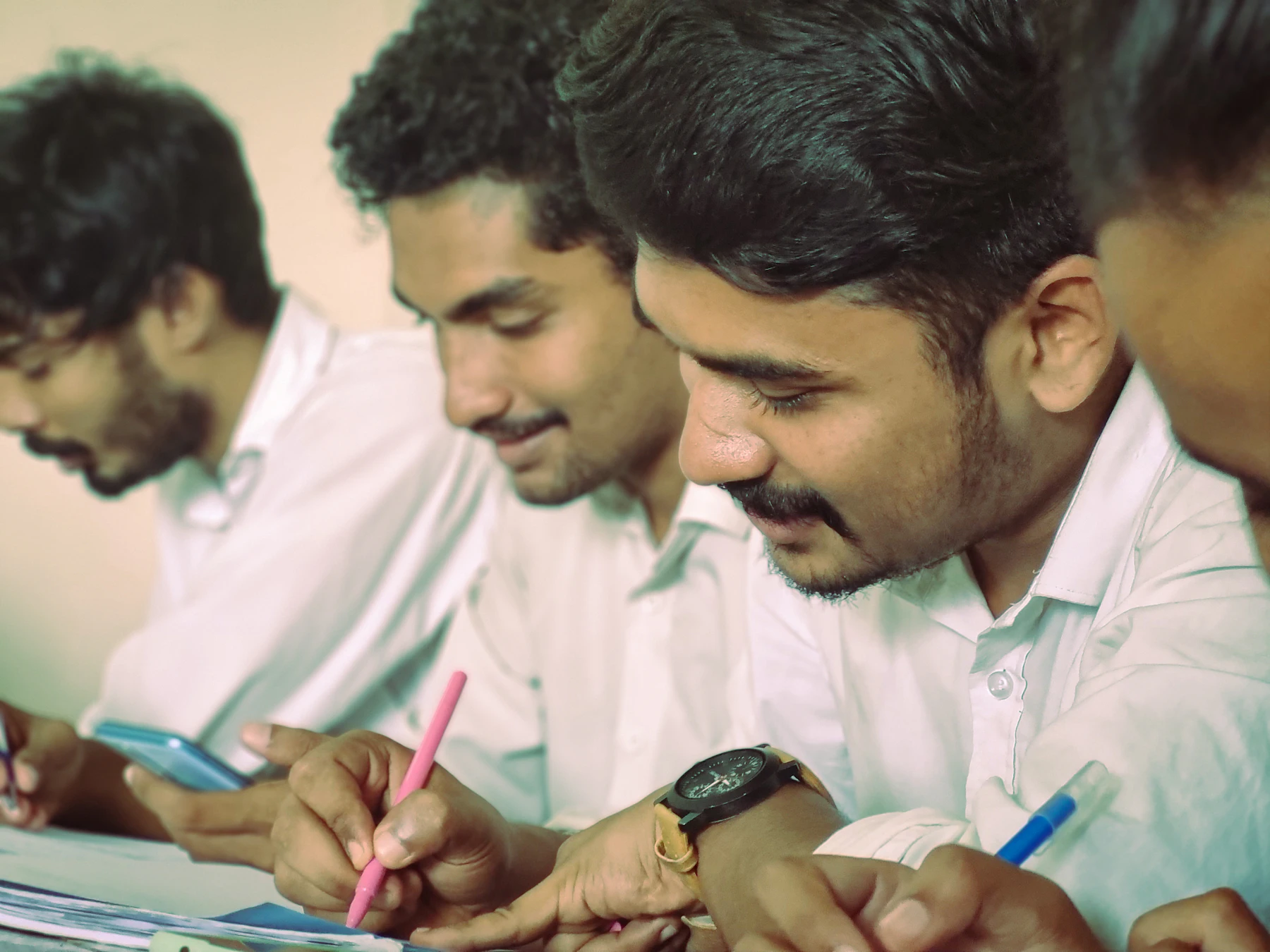 Students taking notes together